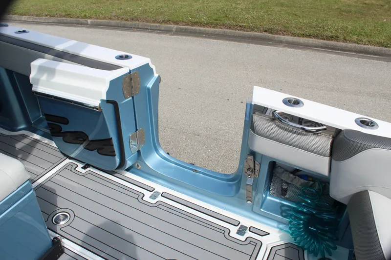 Slide: The Image of 2021 Nor-Tech 390 Sport Center Console boat interior with open side door. - 41