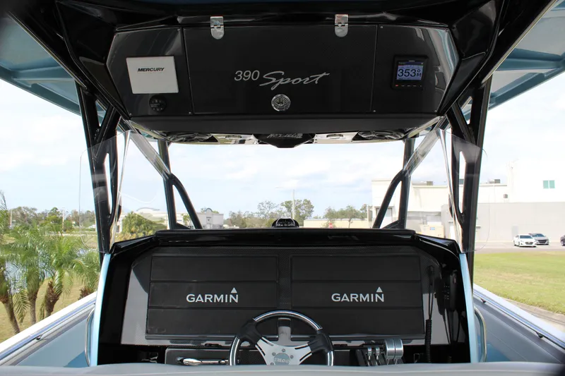 Slide: The Image of 2021 Nor-Tech 390 Sport Center Console with Garmin displays and Mercury controls. - 42