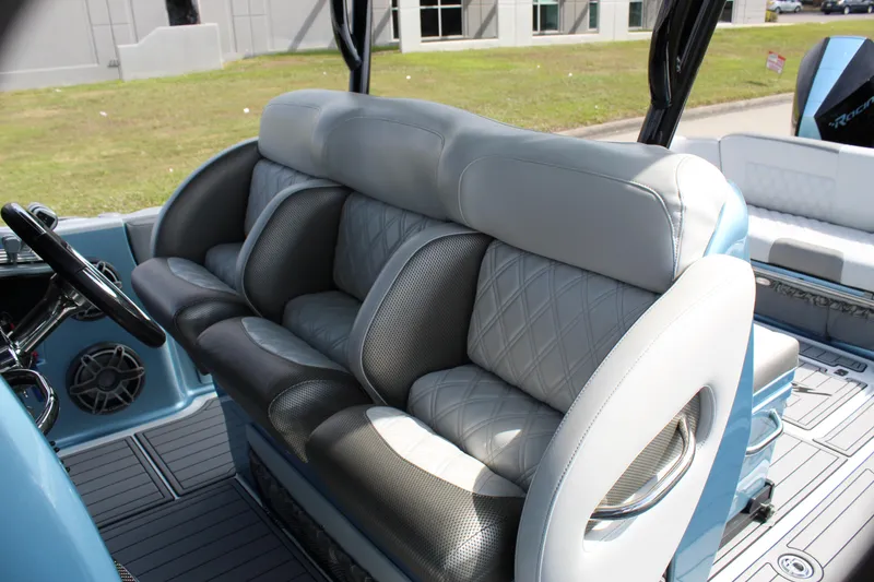 Slide: The Image of 2021 Nor-Tech 390 Sport Center Console interior with luxurious seating and modern design. - 45