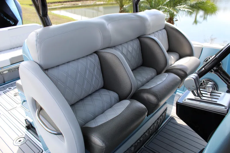 Slide: The Image of 2021 Nor-Tech 390 Sport Center Console interior seating with luxurious upholstery and modern design. - 46