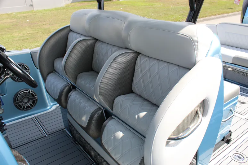 Slide: The Image of Luxury seating on 2021 Nor-Tech 390 Sport Center Console boat, featuring plush, diamond-stitched upholstery. - 48