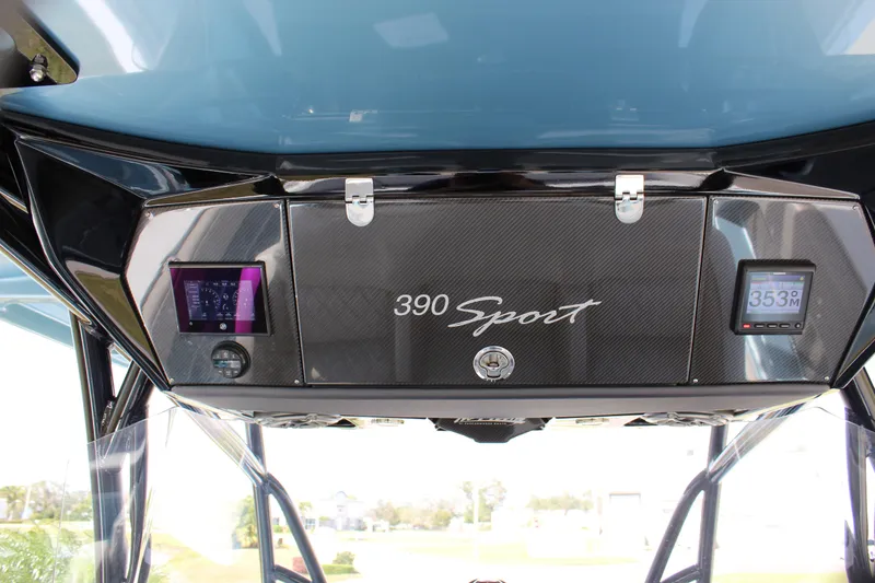 Slide: The Image of 2021 Nor-Tech 390 Sport Center Console dashboard with digital displays and sleek design. - 52