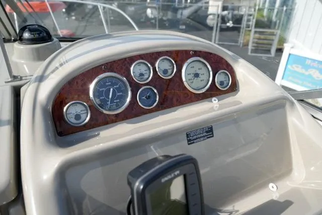 Slide: The Image of Dashboard of 1999 Bayliner 2655 Ciera Sunbridge with gauges and navigation equipment. - 16