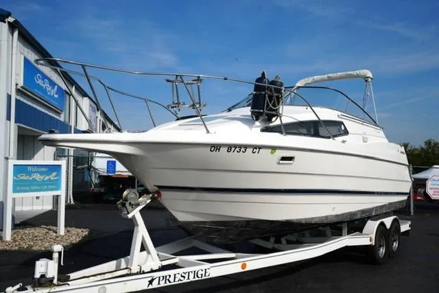 The Image of 1999 Bayliner 2655 Ciera Sunbridge on trailer at marina, side view. - 5