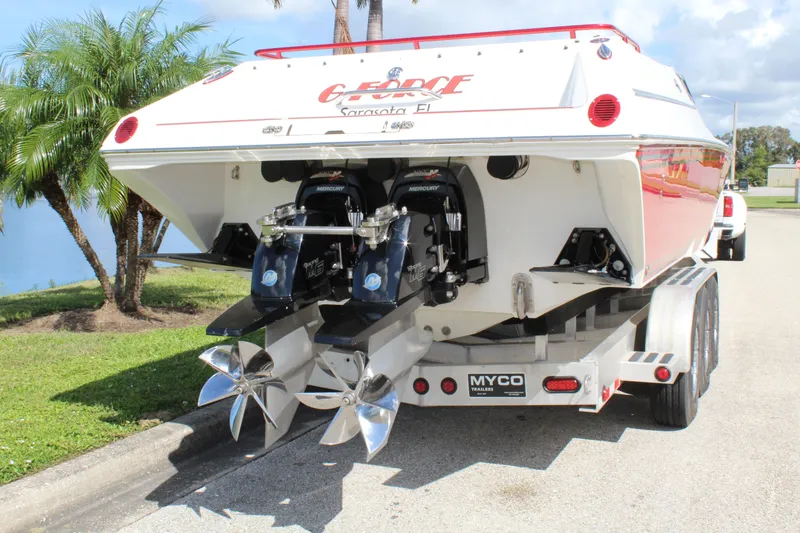 Slide: The Image of 2007 Fountain 42 Lightning boat on trailer, dual propellers, parked near palm trees. - 15