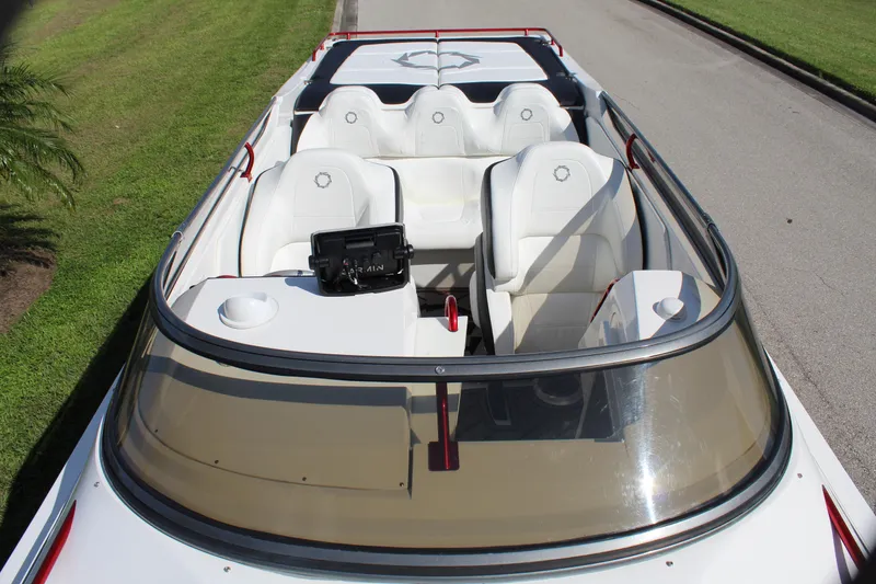 Slide: The Image of 2007 Fountain 42 Lightning boat interior with white seating and windshield. - 22