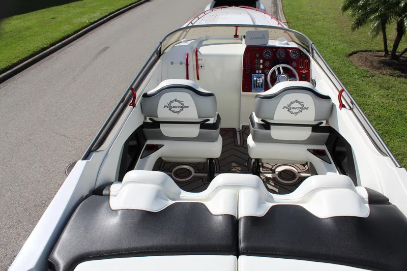 Slide: The Image of 2007 Fountain 42 Lightning boat interior with dual seats and steering wheel. - 29