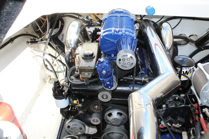 Slide: The Image of Engine of 2007 Fountain 42 Lightning boat with chrome and blue components. - 44