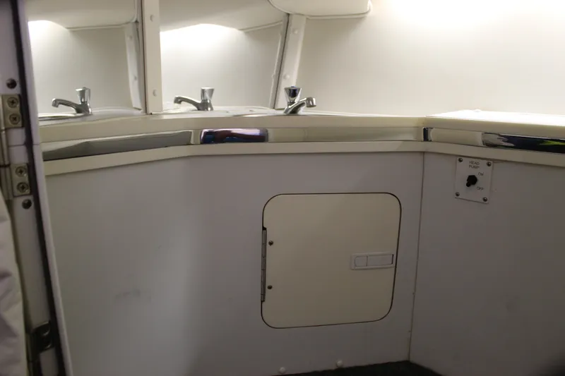 Slide: The Image of 2007 Fountain 42 Lightning boat interior with sink and storage compartment. - 63