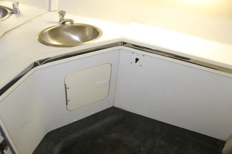 Slide: The Image of 2007 Fountain 42 Lightning boat interior with sink and storage area. - 64