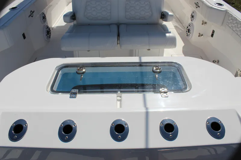 Slide: The Image of 2024 Fountain 32 NX boat interior with seating and livewell. - 28