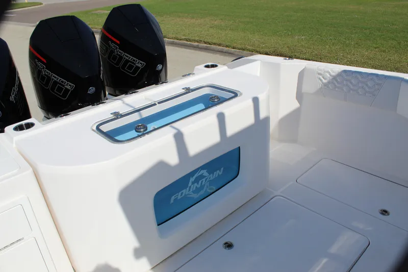 Slide: The Image of 2024 Fountain 32 NX boat interior with dual engines and storage compartments. - 32