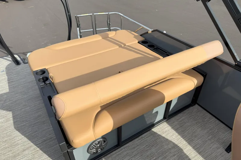 Slide: The Image of 2026 Godfrey SWEETWATER 2286 SFL boat with tan seating and cup holders. - 13