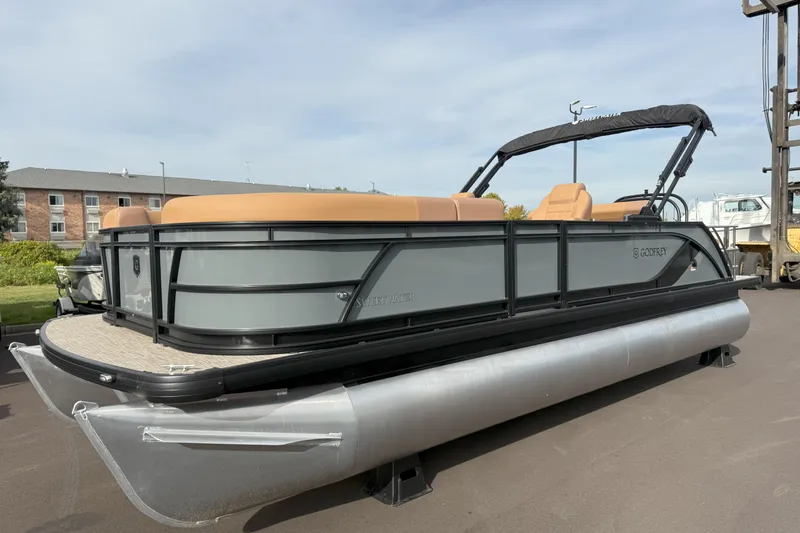 Slide: The Image of 2026 Godfrey SWEETWATER 2286 SFL pontoon boat with tan seating and black frame. - 5