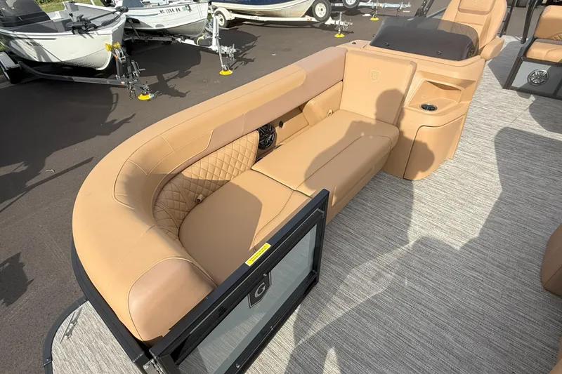 Slide: The Image of Luxurious seating on 2026 Godfrey SWEETWATER 2286 SFL pontoon boat, featuring tan upholstery. - 7