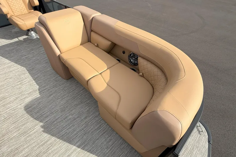 Slide: The Image of Luxurious seating on 2026 Godfrey SWEETWATER 2286 SFL pontoon boat, featuring tan upholstery. - 8