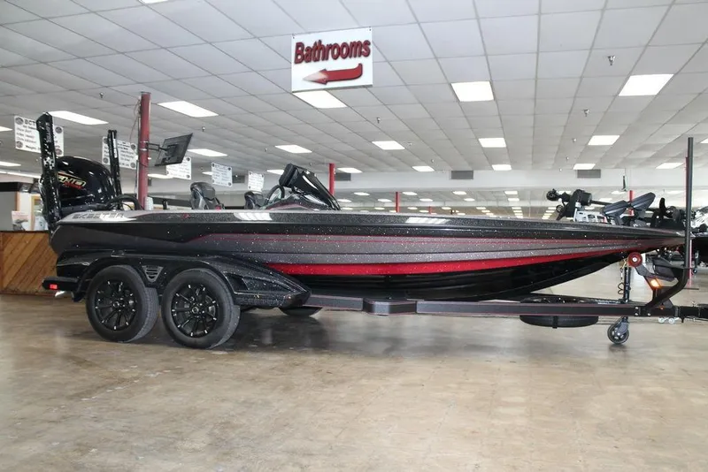 The Image of 2025 Skeeter FXR20 Limited boat displayed indoors on a trailer. - 1