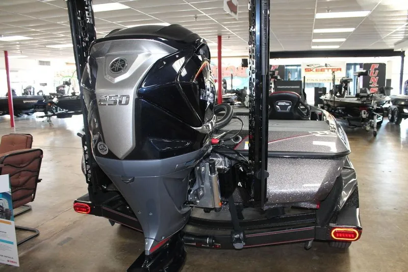 Slide: The Image of 2025 Skeeter FXR20 Limited boat with powerful 250 engine in showroom. - 4