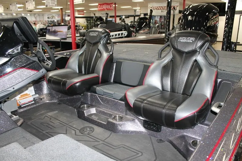 Slide: The Image of 2025 Skeeter FXR20 Limited boat interior with sleek black and gray seats. - 6