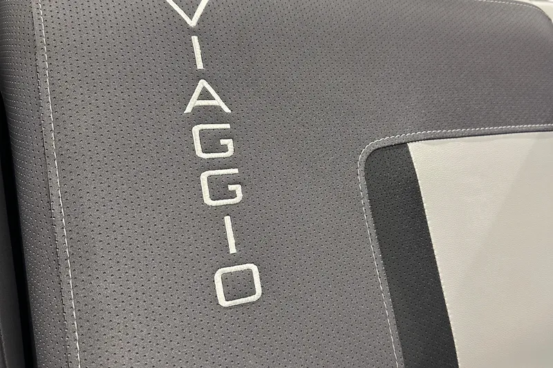 Slide: The Image of Gray Viaggio Lago X20U 2026 seat with embroidered logo detail. - 14