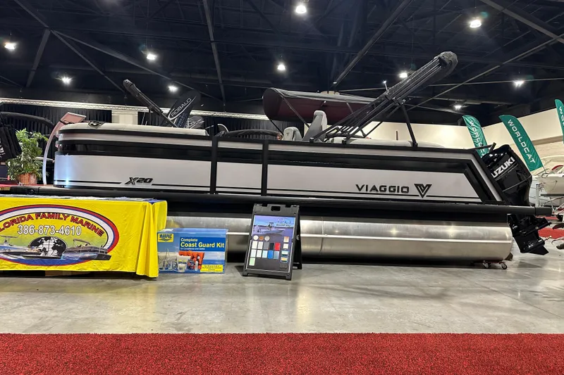 Slide: The Image of 2026 Viaggio Lago X20U pontoon boat displayed at a marine exhibition. - 2