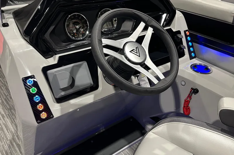 Slide: The Image of 2026 Viaggio Lago X20U boat dashboard with steering wheel and illuminated controls. - 9