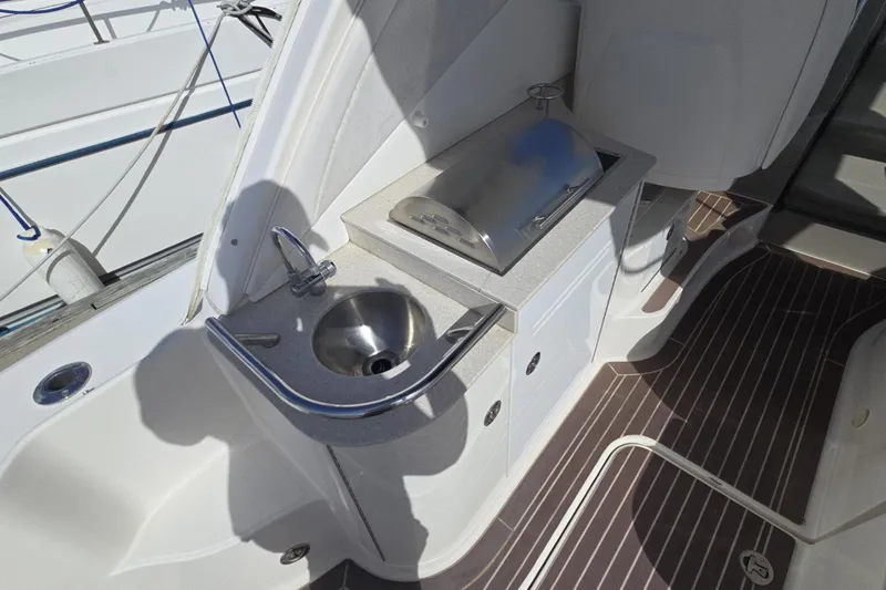 Slide: The Image of Outdoor kitchenette on 2010 Sea Ray 350 Sundancer yacht with sink and grill. - 16