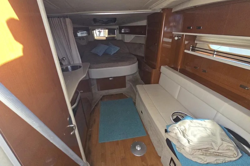 Slide: The Image of Interior of 2010 Sea Ray 350 Sundancer yacht with cozy seating and sleeping area. - 5