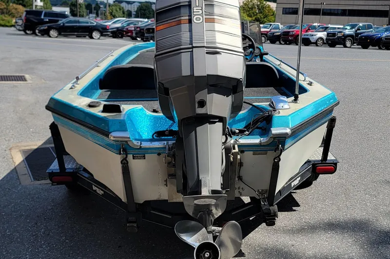 Slide: The Image of 1995 Champion 181 SC boat with outboard motor in parking lot. - 10