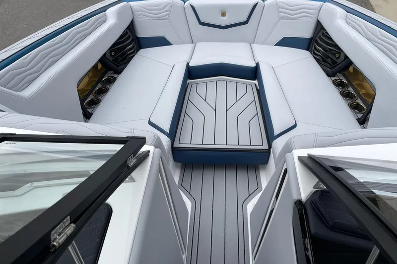Slide: The Image of 2026 Nautique Super Air Nautique G25 interior with luxurious seating and modern design. - 11