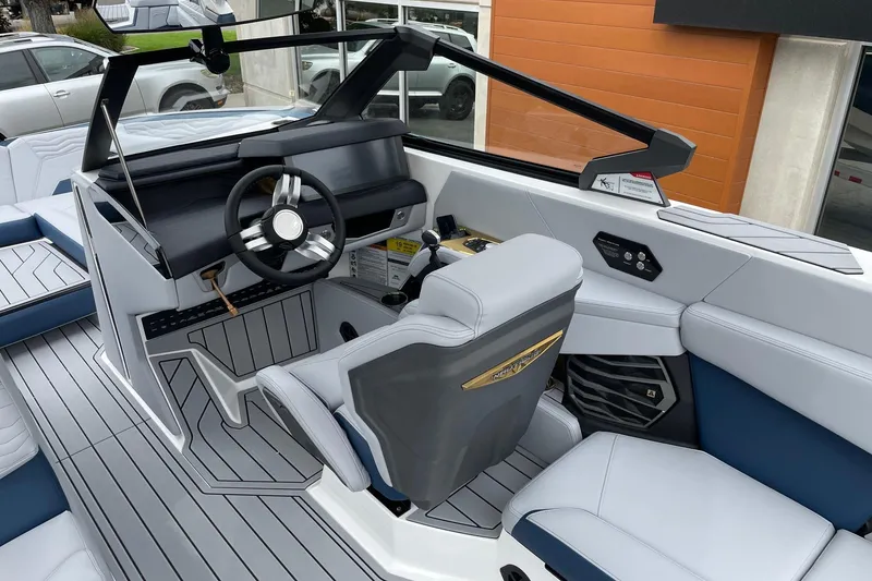 Slide: The Image of Interior of 2026 Nautique Super Air Nautique G25 boat, featuring sleek design and modern controls. - 6