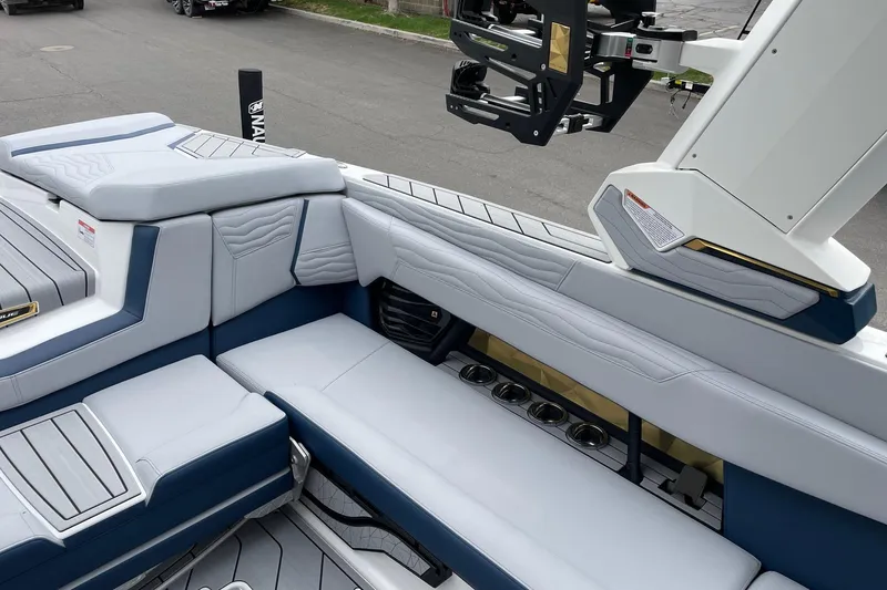 Slide: The Image of 2026 Nautique Super Air Nautique G25 interior with luxurious seating and cup holders. - 9