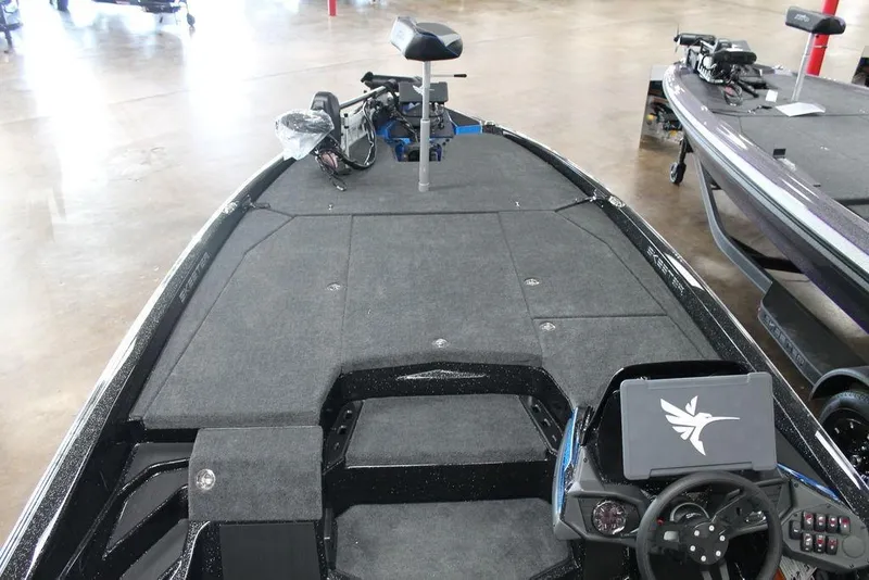 Slide: The Image of 2026 Skeeter ZXE21 boat interior with advanced dashboard and spacious deck. - 10