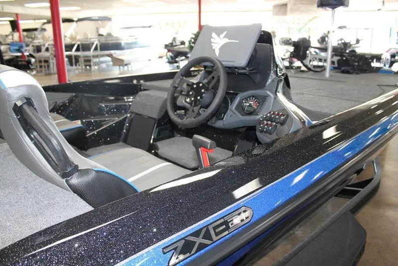 Slide: The Image of 2026 Skeeter ZXE21 boat interior with steering wheel and dashboard controls. - 4