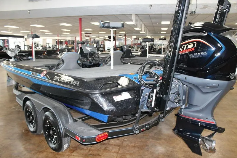Slide: The Image of 2026 Skeeter ZXE21 bass boat with Yamaha engine in showroom. - 5