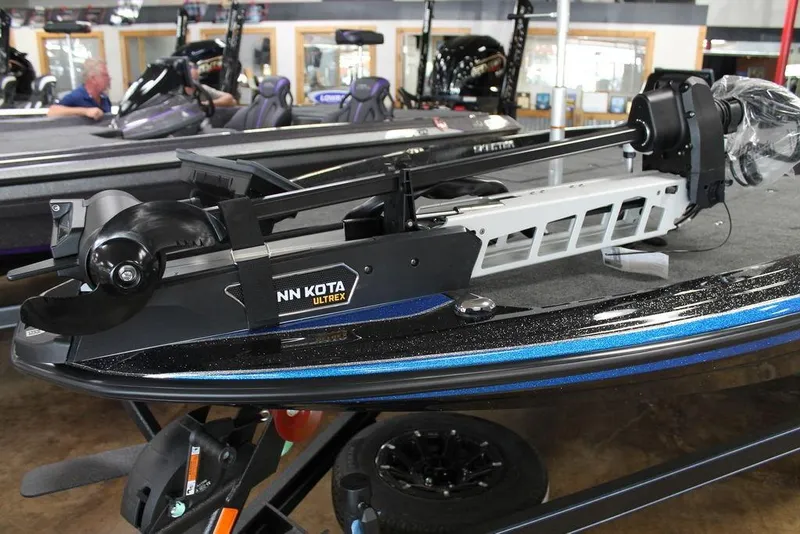 Slide: The Image of 2026 Skeeter ZXE21 boat with Minn Kota Ultrex trolling motor in showroom. - 8