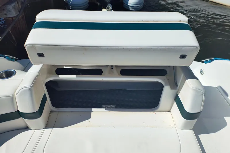 Slide: The Image of 2003 Formula 260 Sun Sport boat interior with steering wheel, dashboard, and seating. - 13