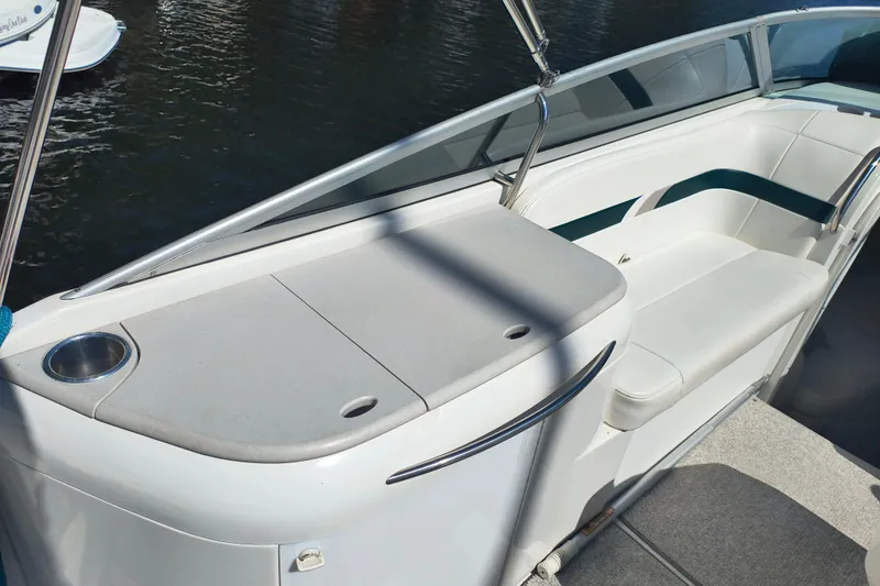Slide: The Image of Interior view of a 2003 Formula 260 Sun Sport boat cockpit with steering wheel and controls. - 14