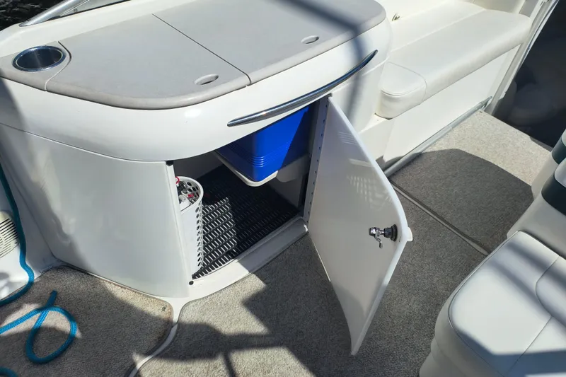 Slide: The Image of 2003 Formula 260 Sun Sport boat interior with white seating and open deck layout. - 16