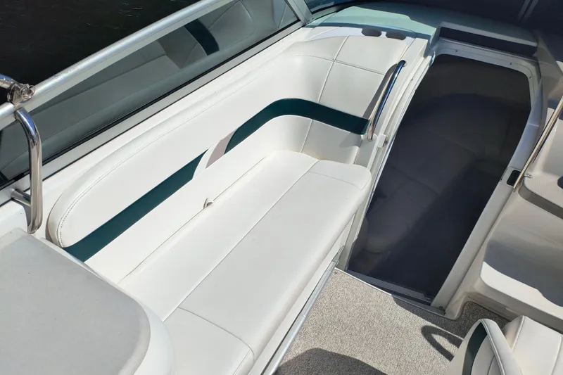 Slide: The Image of 2003 Formula 260 Sun Sport boat interior with white seating and sleek design. - 17