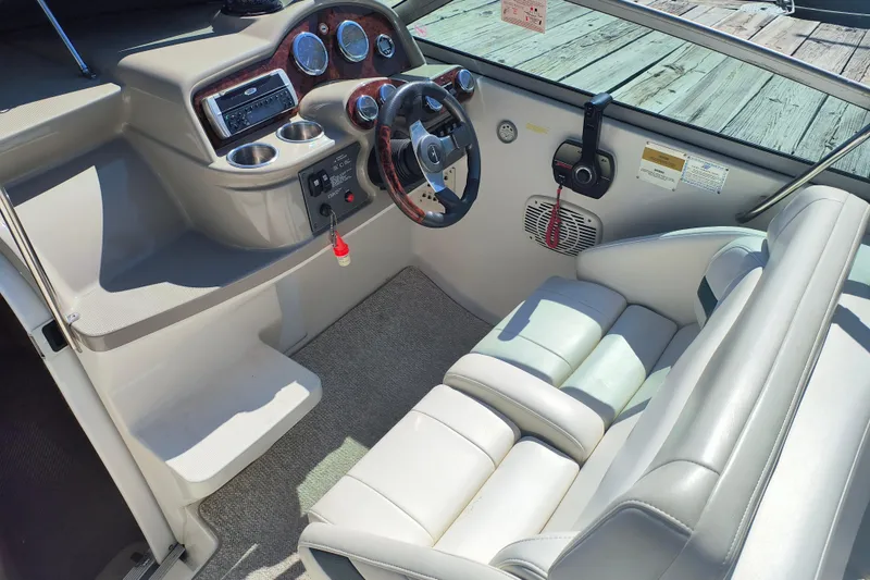 Slide: The Image of 2003 Formula 260 Sun Sport boat interior with white seating and carpeted floor. - 19