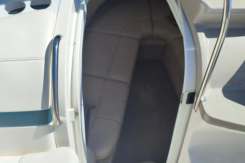 Slide: The Image of 2003 Formula 260 Sun Sport boat interior with sink and seating area. - 23