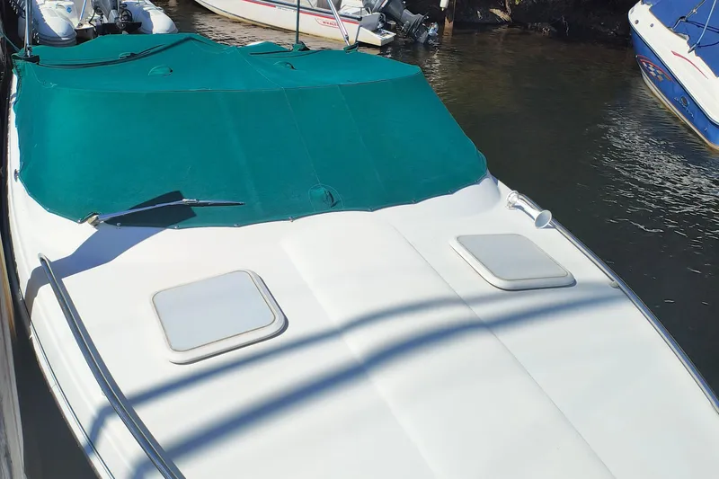 Slide: The Image of 2003 Formula 260 Sun Sport cabin interior with cushioned seating and pillows. - 7