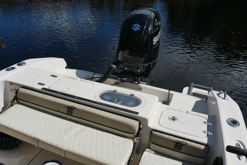 Slide: The Image of 2022 Carolina Skiff 23 Ultra Elite boat with Suzuki outboard motor on calm water. - 20