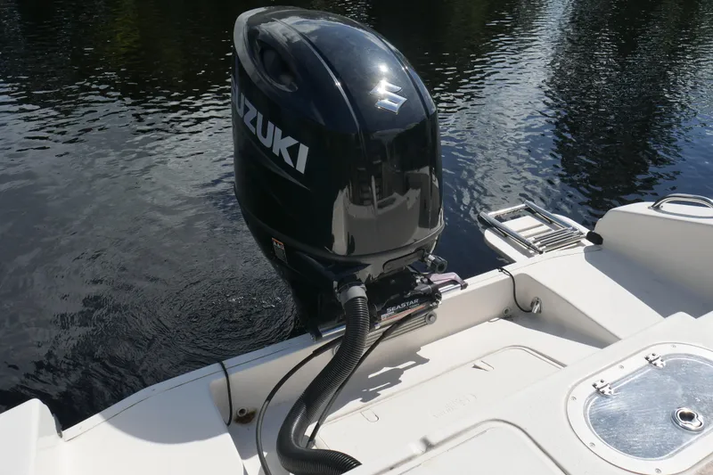 Slide: The Image of 2022 Carolina Skiff 23 Ultra Elite with Suzuki outboard motor on calm water. - 21