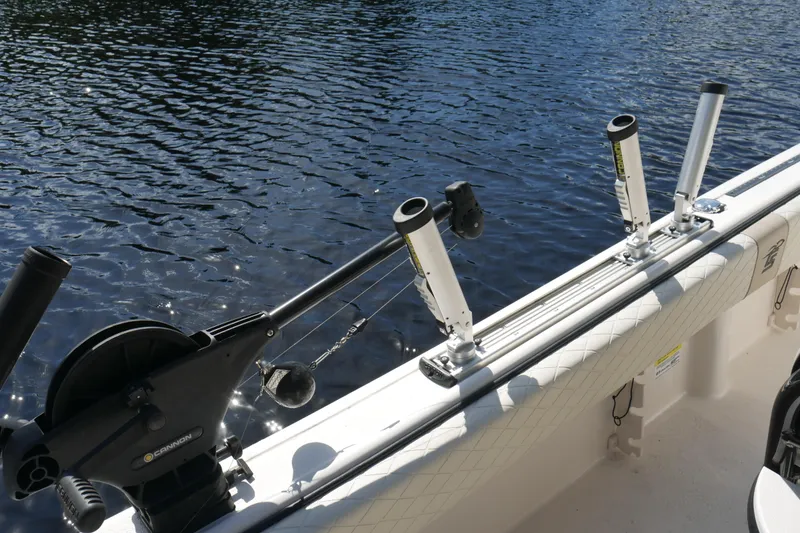 Slide: The Image of Fishing rod holders on a 2022 Carolina Skiff 23 Ultra Elite boat by the water. - 26
