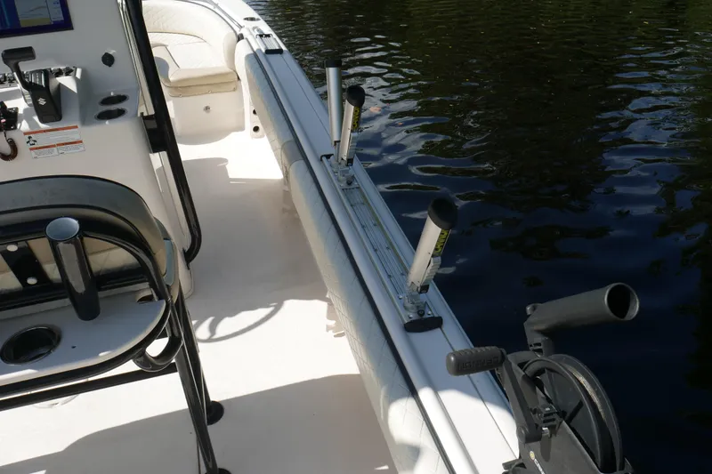 Slide: The Image of 2022 Carolina Skiff 23 Ultra Elite boat interior with rod holders and seating. - 29