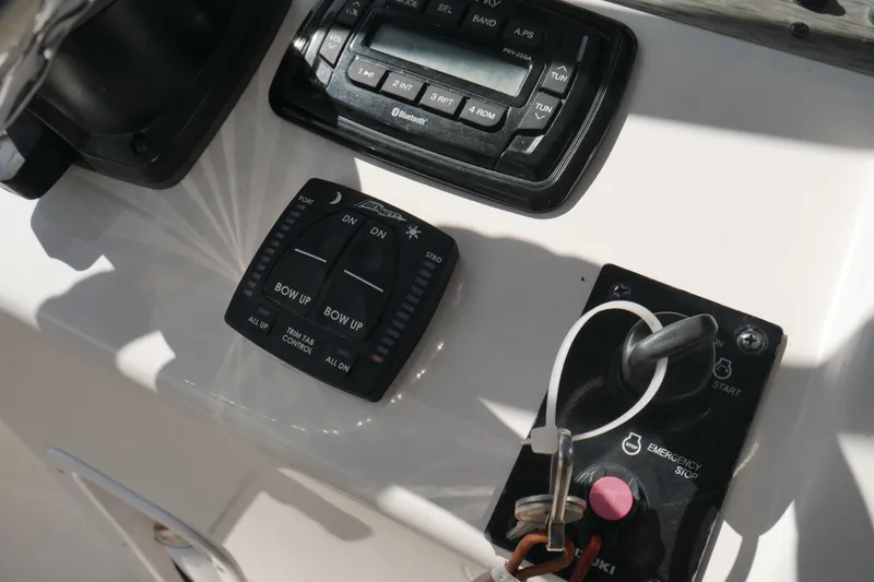 Slide: The Image of Control panel of a 2022 Carolina Skiff 23 Ultra Elite boat with trim tab and ignition. - 32