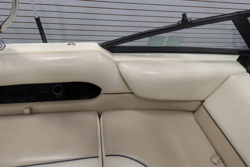 Slide: The Image of 1998 Malibu Sunsetter VLX interior with cream leather seats and sleek design. - 20