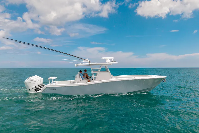 The Image of 2023 Invincible 36 Open Fisherman boat cruising on open ocean under blue sky. - 0